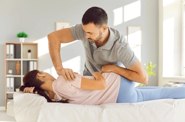 young woman getting chiropractic adjustment